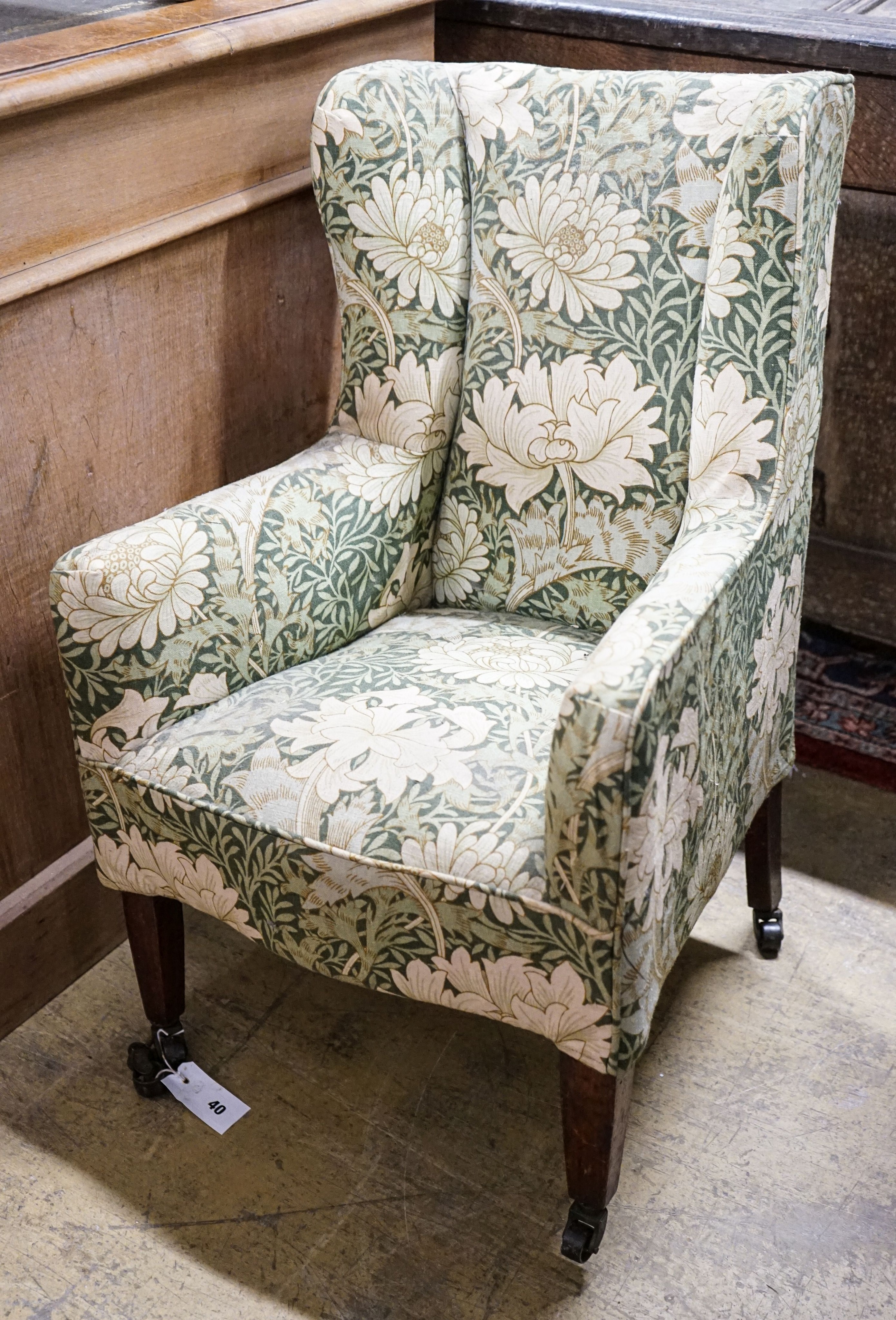 A George III mahogany child's armchair, with square tapered legs fitted brass castors, width 49cm, depth 48cm, height 78cm